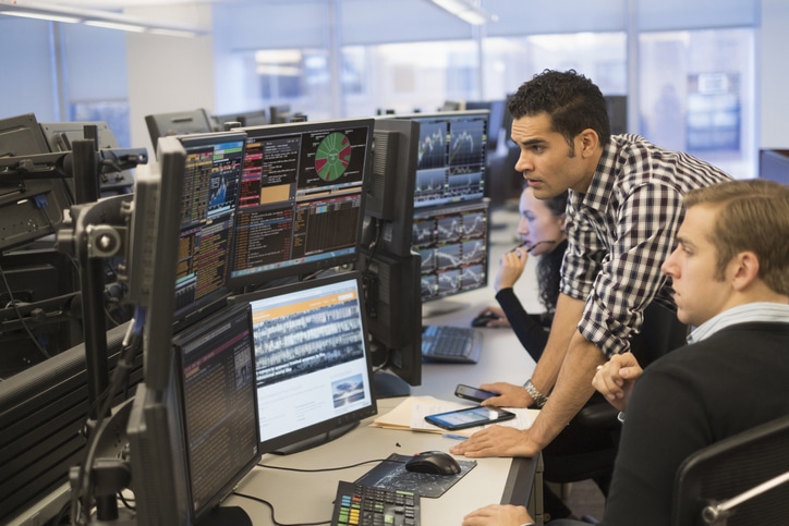 Young Traders Analyzing Surveillance Data - KX